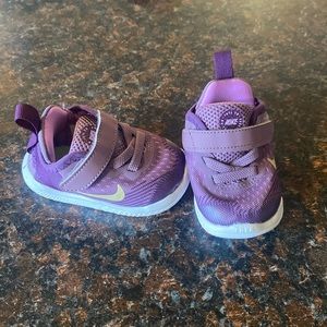 Baby Nike shoe. Purple in color. Excellent used condition